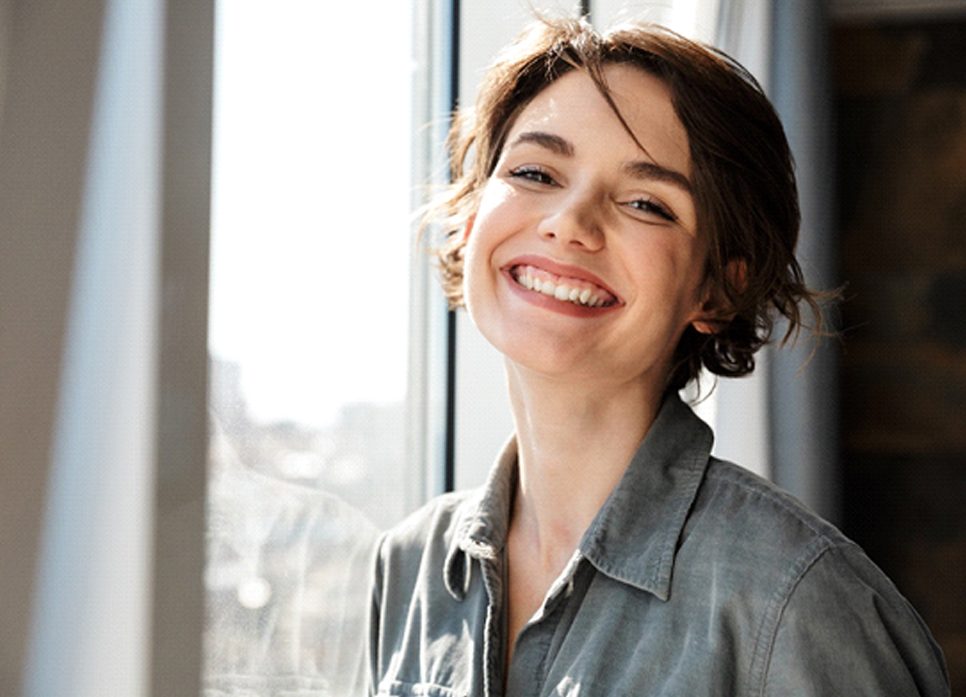 woman smiling with dental crowns in Spring Hill