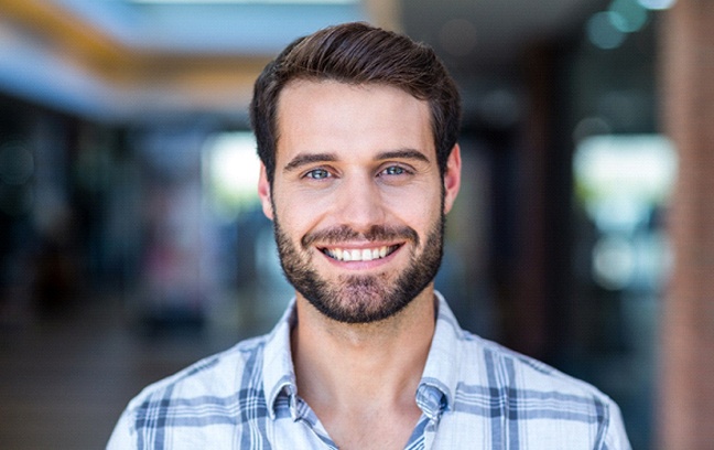 man smiling with dental crowns in Spring Hill