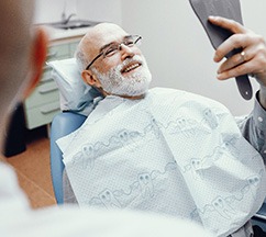 A close-up of a young man with missing teeth