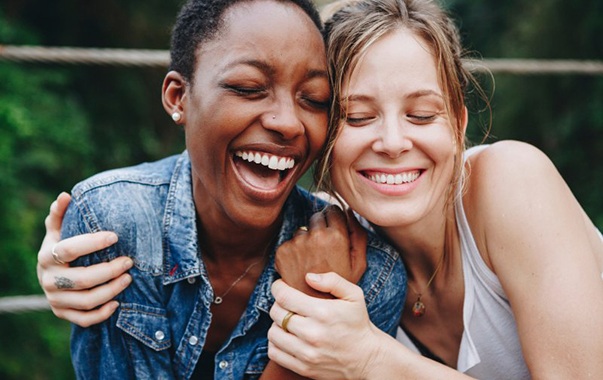 Happy Spring Hill patient smiling with friend