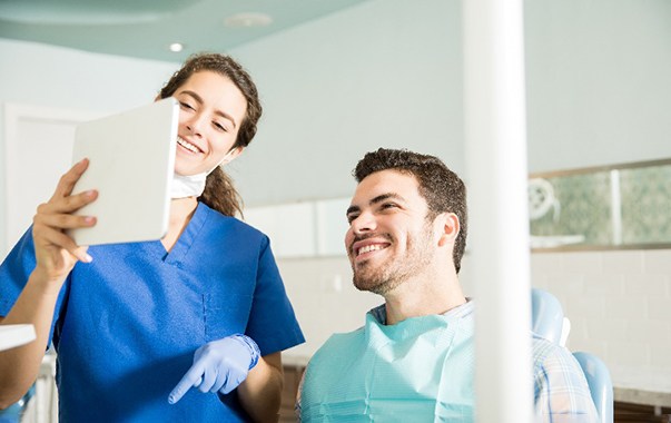 Spring Hill cosmetic dentist explaining treatment to patient