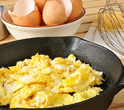 Scrambled eggs in a cast iron skillet