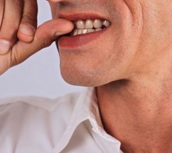 a person biting their nails