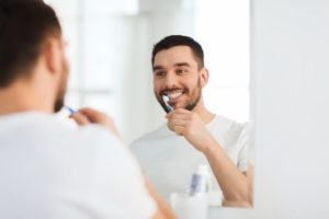 Man brushing teeth