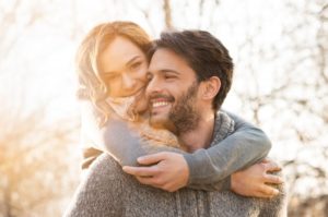 Healthy couple smiles after visiting their Spring Hill cosmetic dentist