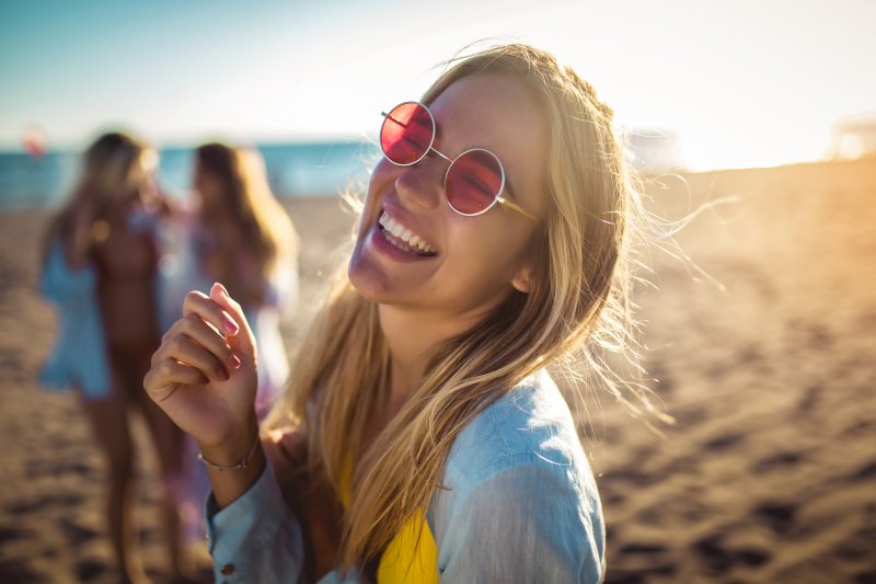 Smiling woman on beach