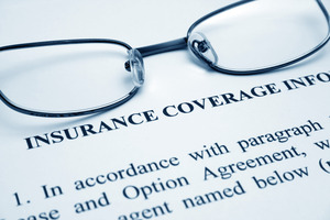Glasses on top of dental insurance information sheet