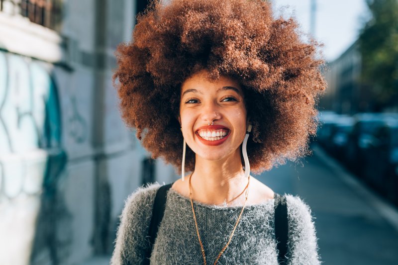 a person with dental implants smiling 